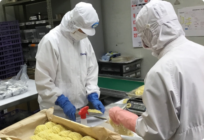 Certified noodle craftsmen at work